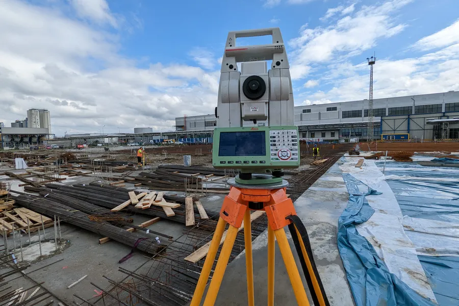 Surveying engineer during fieldwork with total station